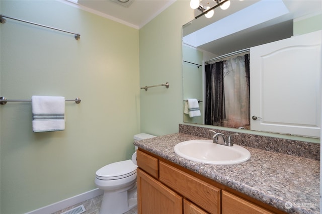 bathroom featuring curtained shower, vanity, ornamental molding, toilet, and tile patterned floors