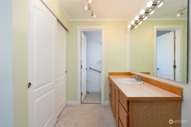 bathroom with vanity and rail lighting