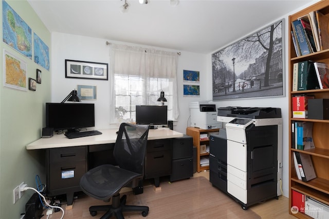 office with light hardwood / wood-style flooring