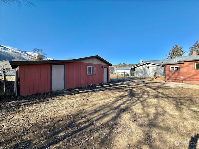 view of outbuilding with a mountain view