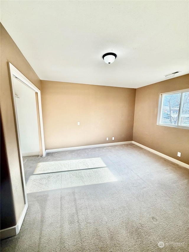 unfurnished room with carpet flooring