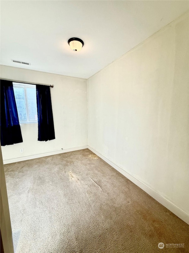 view of carpeted spare room