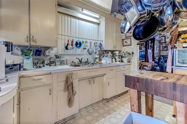 kitchen with sink and white cabinets