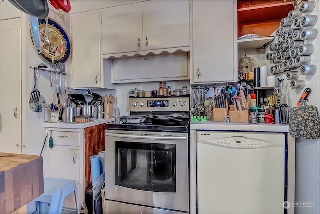 kitchen featuring white cabinets, electric range, and dishwasher