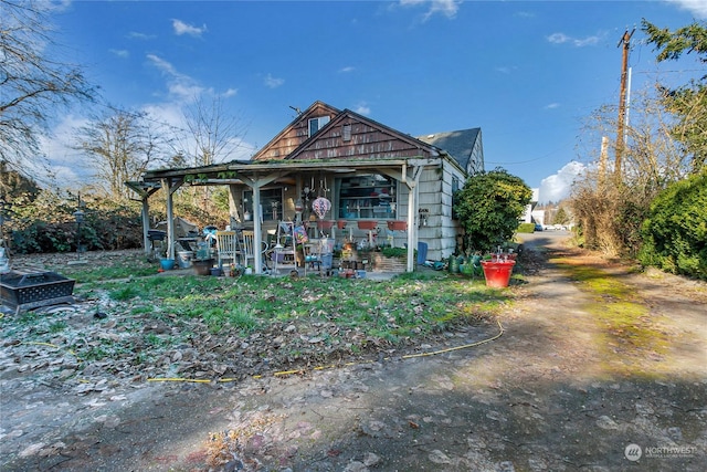 view of outbuilding with covered porch