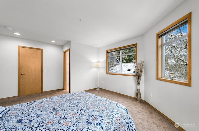 bedroom featuring light carpet