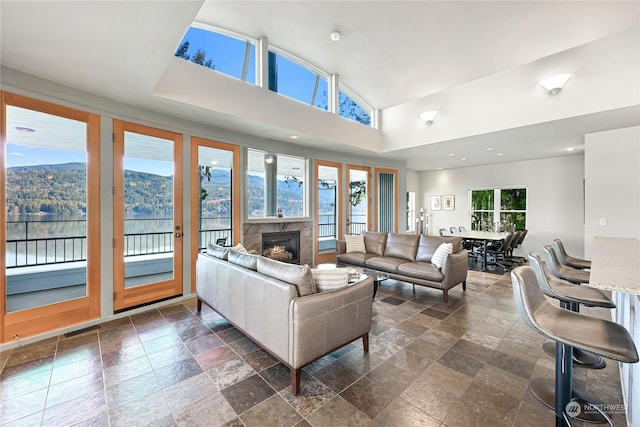 living room with a mountain view and a towering ceiling