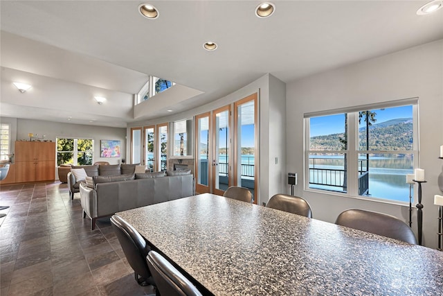 kitchen with a water view and a kitchen bar
