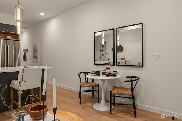 dining area with light hardwood / wood-style flooring