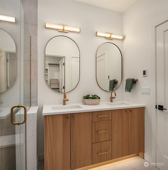 bathroom with an enclosed shower and vanity