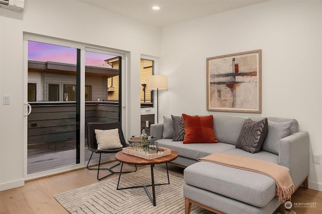 living area with light hardwood / wood-style flooring