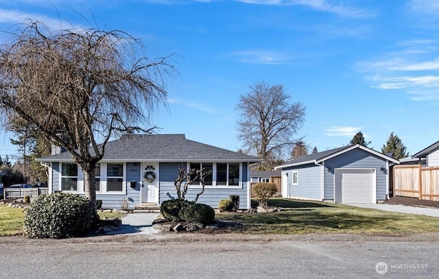 ranch-style house featuring a garage and a front lawn