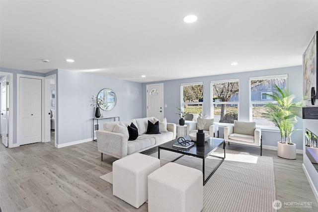 living room with light hardwood / wood-style floors