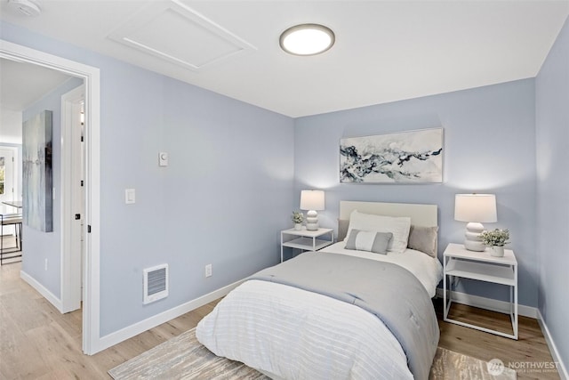 bedroom with light wood-type flooring