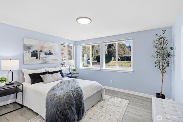 bedroom with hardwood / wood-style floors