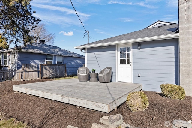 rear view of house featuring a deck