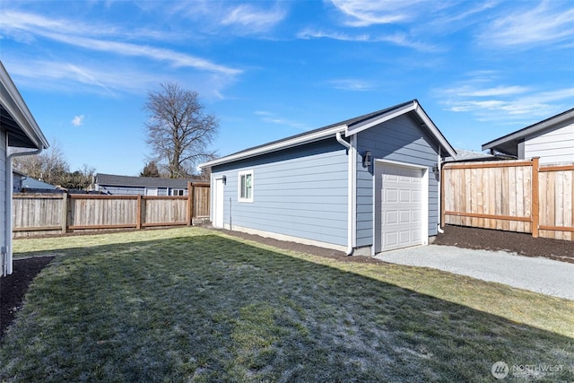 garage featuring a lawn