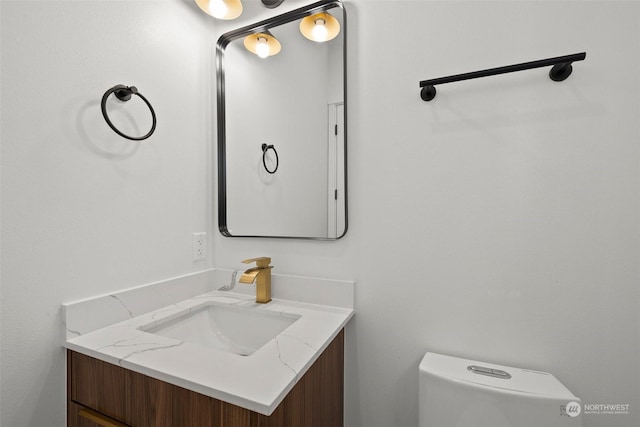 bathroom with vanity and toilet