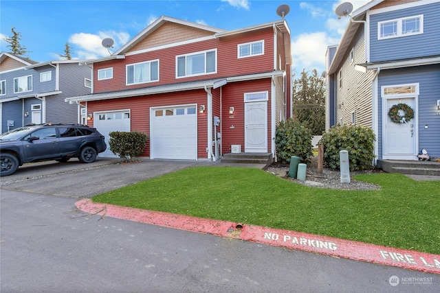 view of front of house featuring a garage and a front lawn