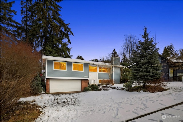 raised ranch featuring a garage