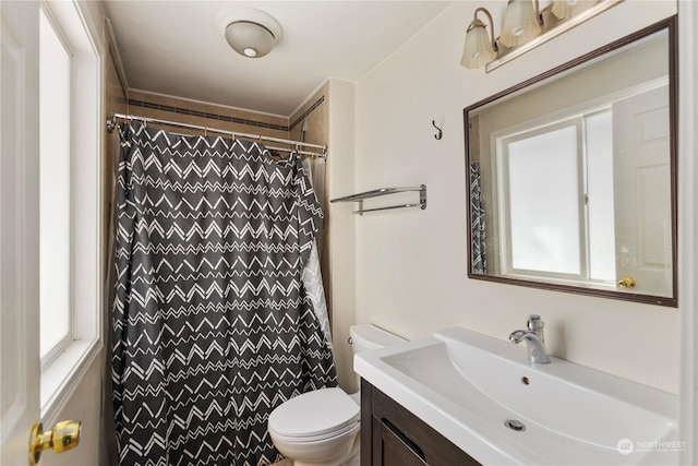 bathroom with vanity, toilet, and a shower with shower curtain