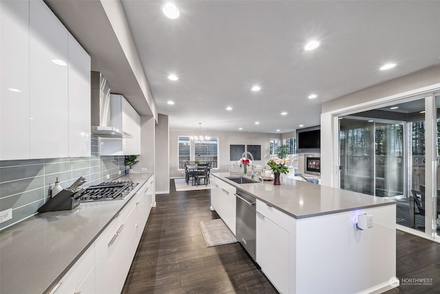 kitchen featuring a large island, white cabinetry, and appliances with stainless steel finishes