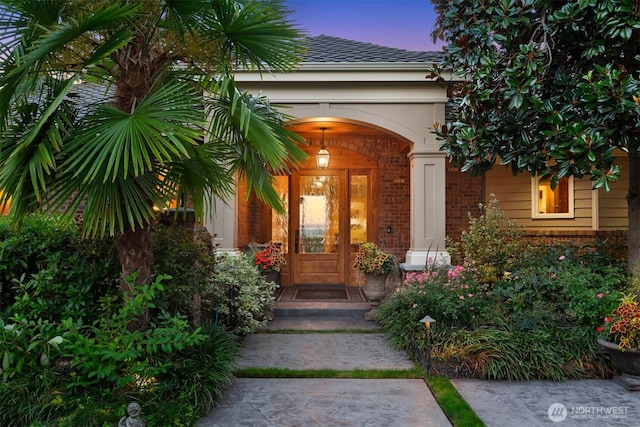 property entrance with brick siding