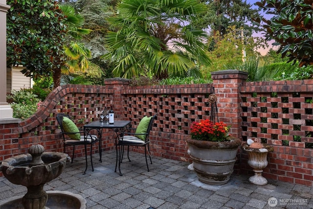 view of patio terrace at dusk