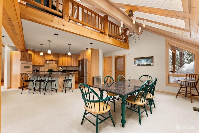 carpeted dining room featuring a notable chandelier, wood ceiling, beam ceiling, and high vaulted ceiling