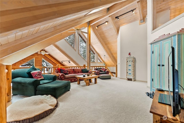 living room featuring wood ceiling, a wealth of natural light, rail lighting, and carpet flooring