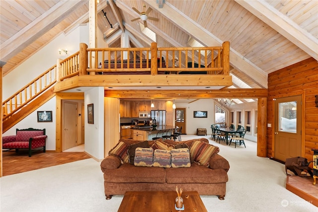 carpeted living room featuring beam ceiling and high vaulted ceiling