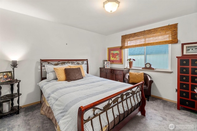 bedroom featuring baseboards and light carpet