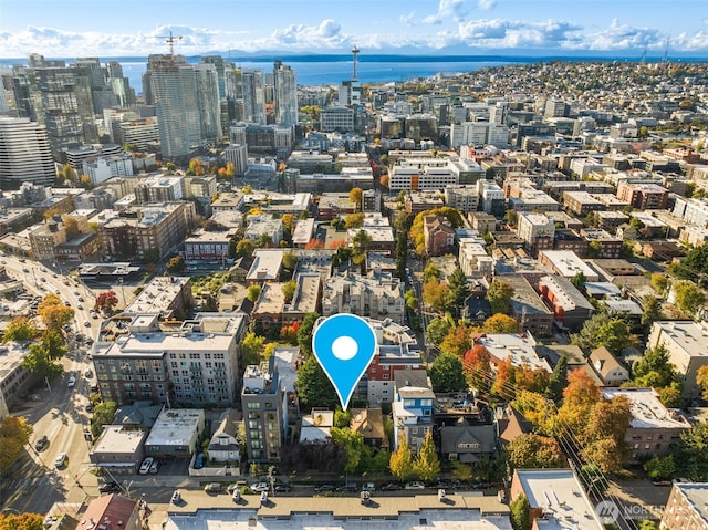 aerial view featuring a water view and a city view