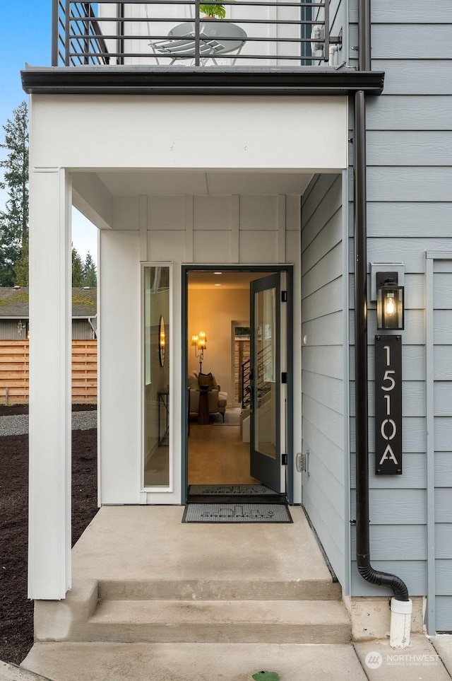 entrance to property with a balcony