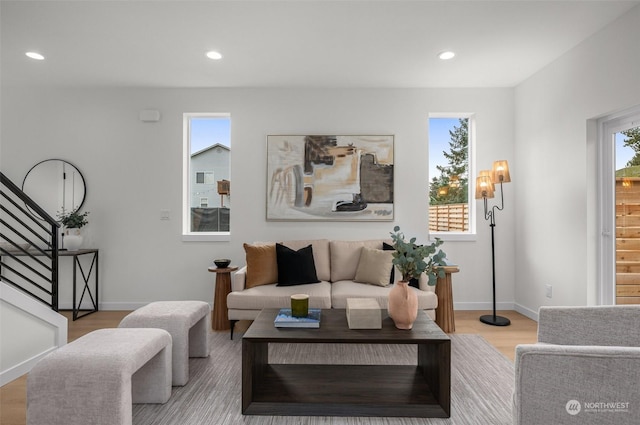 living room with light hardwood / wood-style flooring and a wealth of natural light