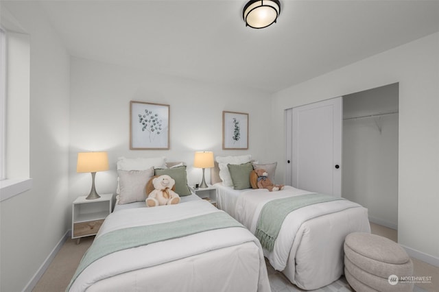 carpeted bedroom with a closet