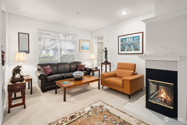 carpeted living room with a fireplace