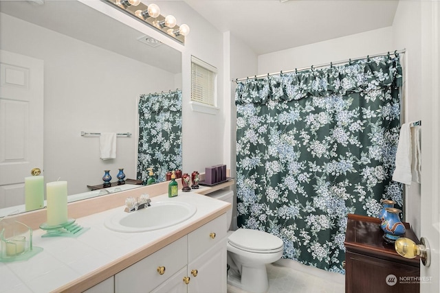 bathroom with vanity and toilet