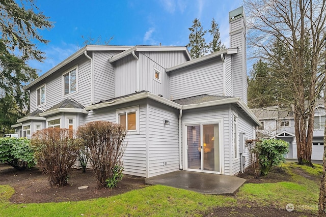 back of property with a patio area