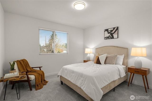 bedroom with carpet flooring and baseboards