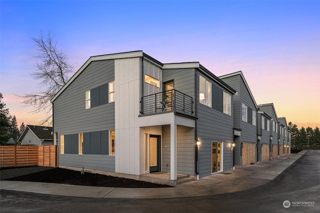 view of front of property with a balcony