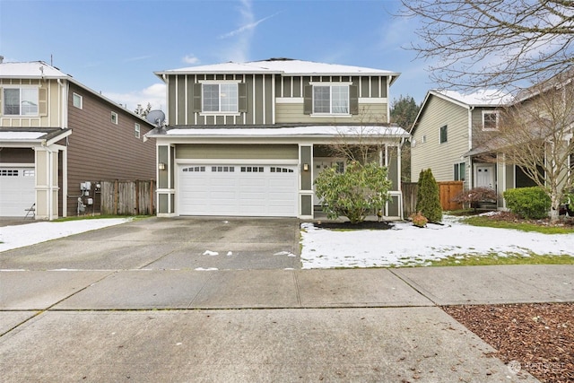 view of front of home with a garage and a sunroom