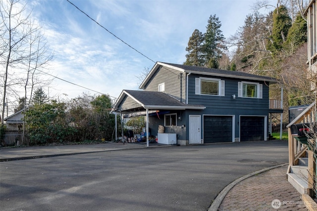 view of front of house featuring a garage and driveway