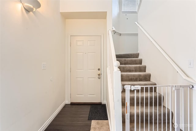 staircase featuring hardwood / wood-style floors