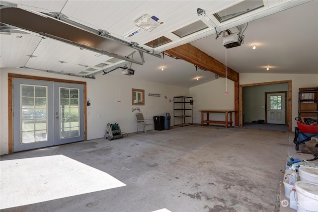 garage featuring a garage door opener and french doors