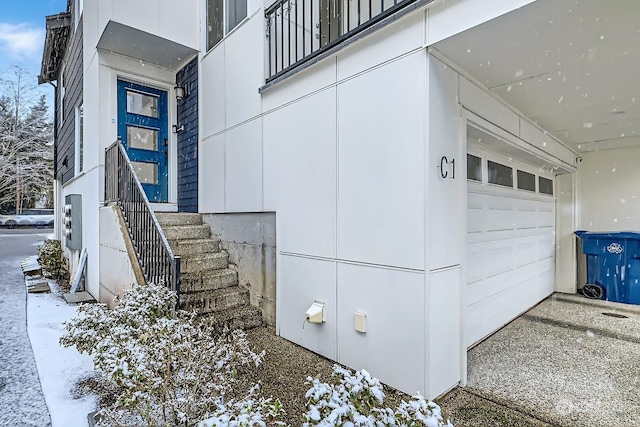 view of snow covered property entrance