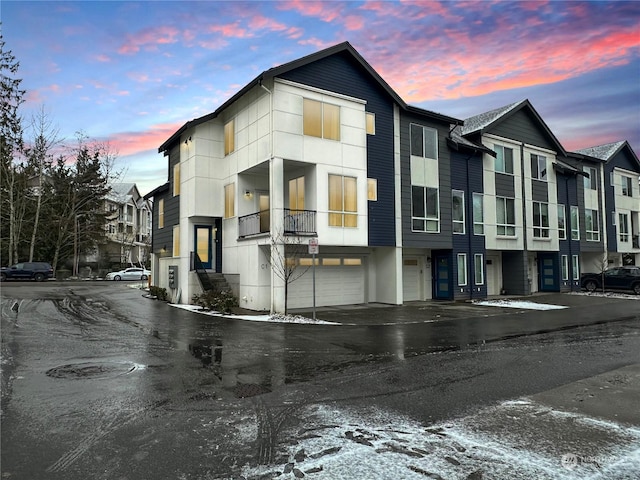 outdoor building at dusk with a garage