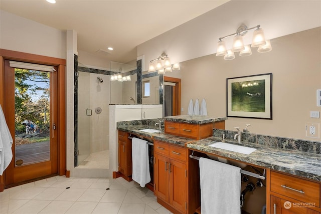 bathroom with tile patterned floors, vanity, and a shower with shower door