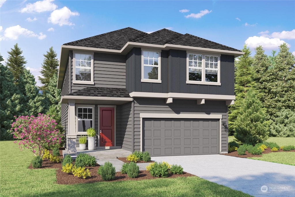 view of property with a garage and a front yard