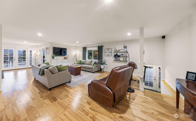 living room featuring light hardwood / wood-style flooring and french doors